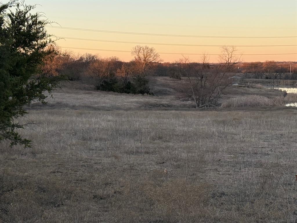 7933 South State Highway 78 Blue Ridge, TX 75424 - Photo 22 of 24 a view of a dry yard with wooden fence
