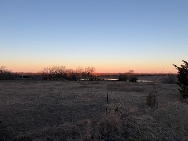 7933 South State Highway 78 Blue Ridge, TX 75424 - Photo 9 of 24 a view of a dry yard with wooden fence