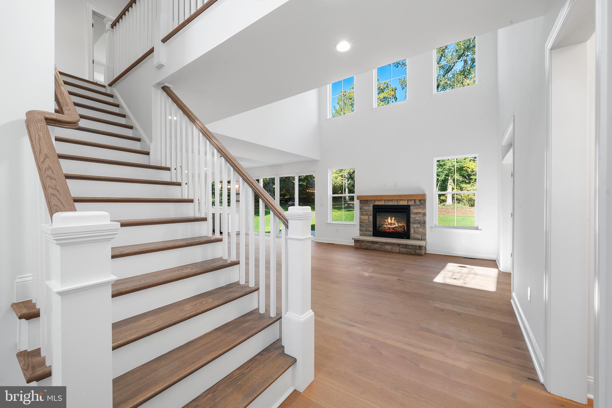 2261 Valley Road Huntingdon Valley, PA 19006 - Photo 5 of 17 a view of a livingroom with wooden floor and a fireplace