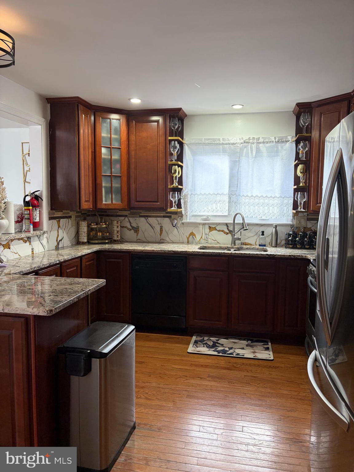 7404 Wyndam Road Pennsauken, NJ 08110 - Photo 14 of 50 a kitchen with a sink and a wooden cabinets