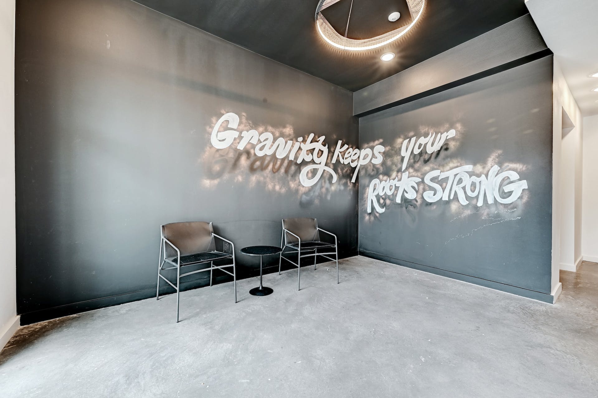4801 Springdale Road, Unit 1301 Austin, TX 78723 - Photo 30 of 39 A dedicated waiting space features a unique wall graphic and industrial-style seating.