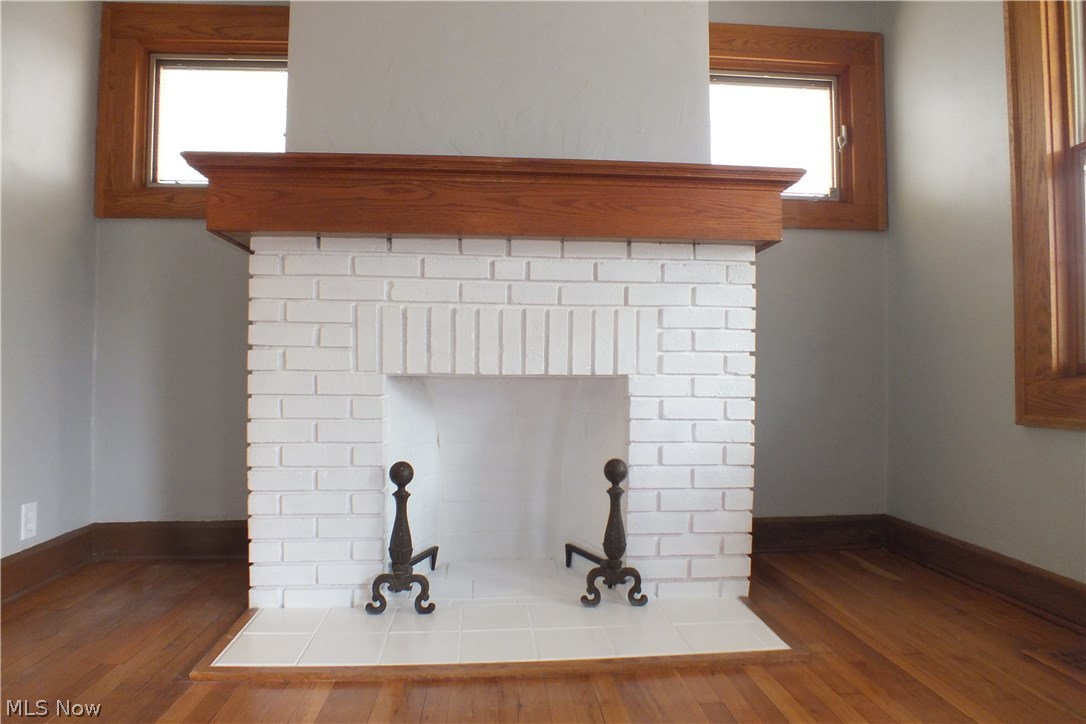 22651 Seabrooke Avenue Euclid, OH 44123 - Photo 8 of 31 The handsome brick fireplace