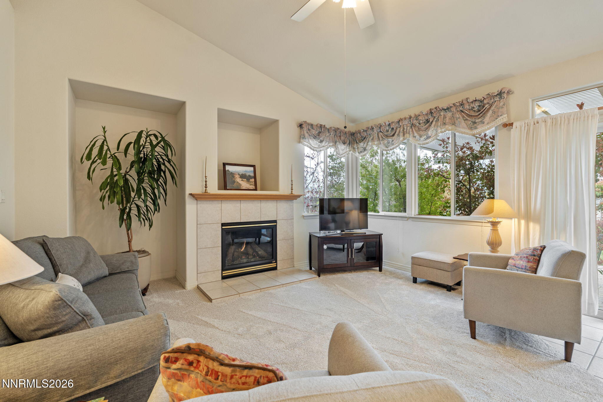 2741 Sunline Drive Reno, NV 89523 - Photo 28 of 47 a living room with furniture fireplace and a large window