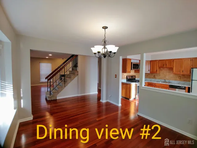 a view of entryway and kitchen
