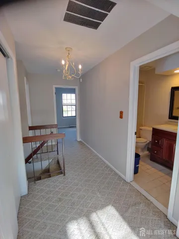 a view of a livingroom with furniture and windows