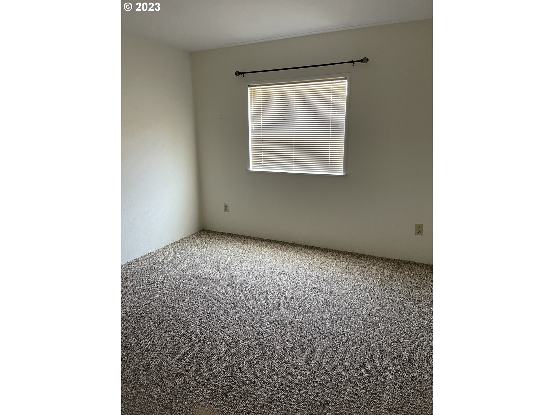 100 River Bend Road, Unit 121 Reedsport, OR 97467 - Photo 14 of 22 a view of an empty room with a window