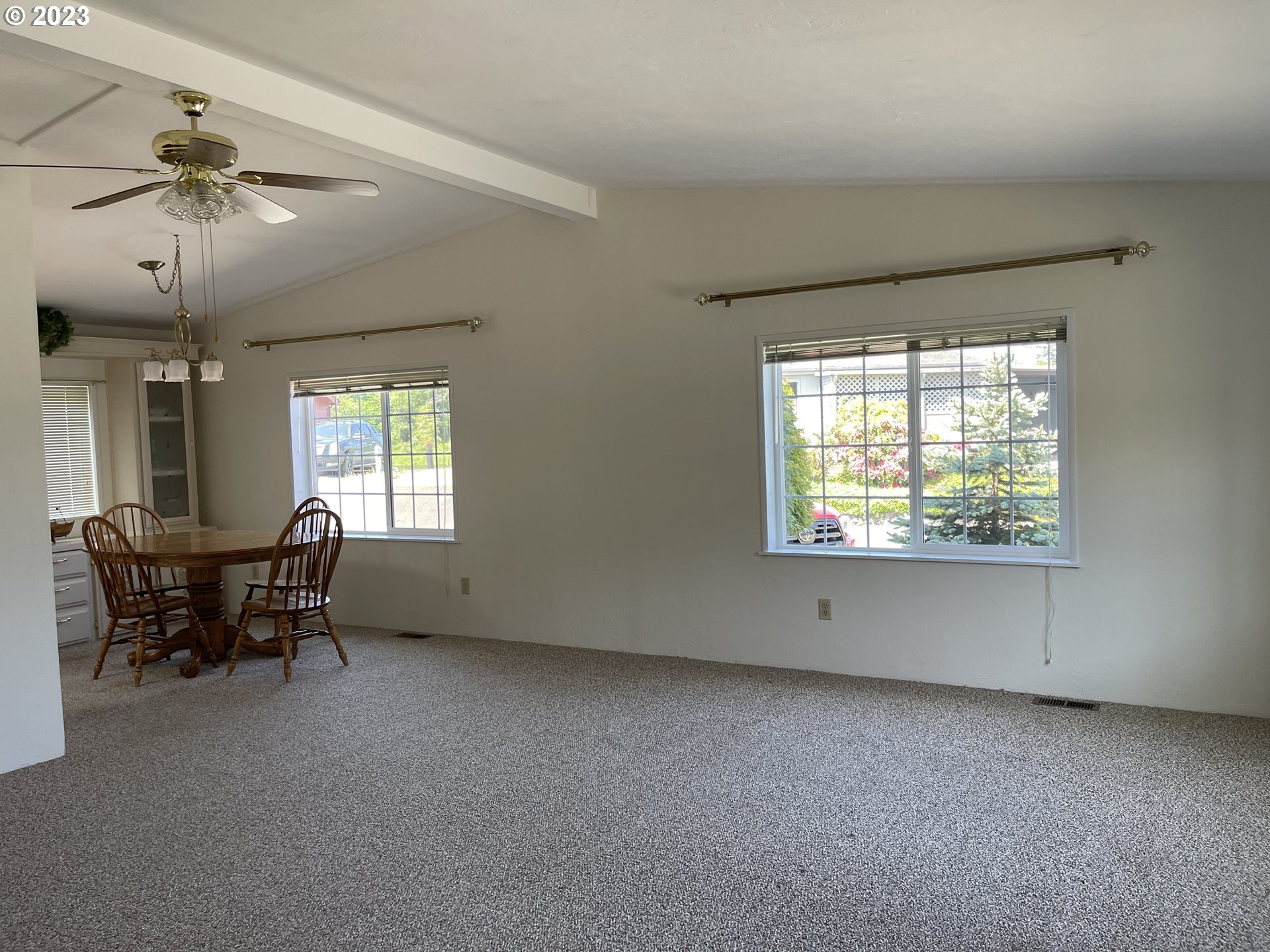 100 River Bend Road, Unit 121 Reedsport, OR 97467 - Photo 2 of 22 an empty room with windows and ceiling fan