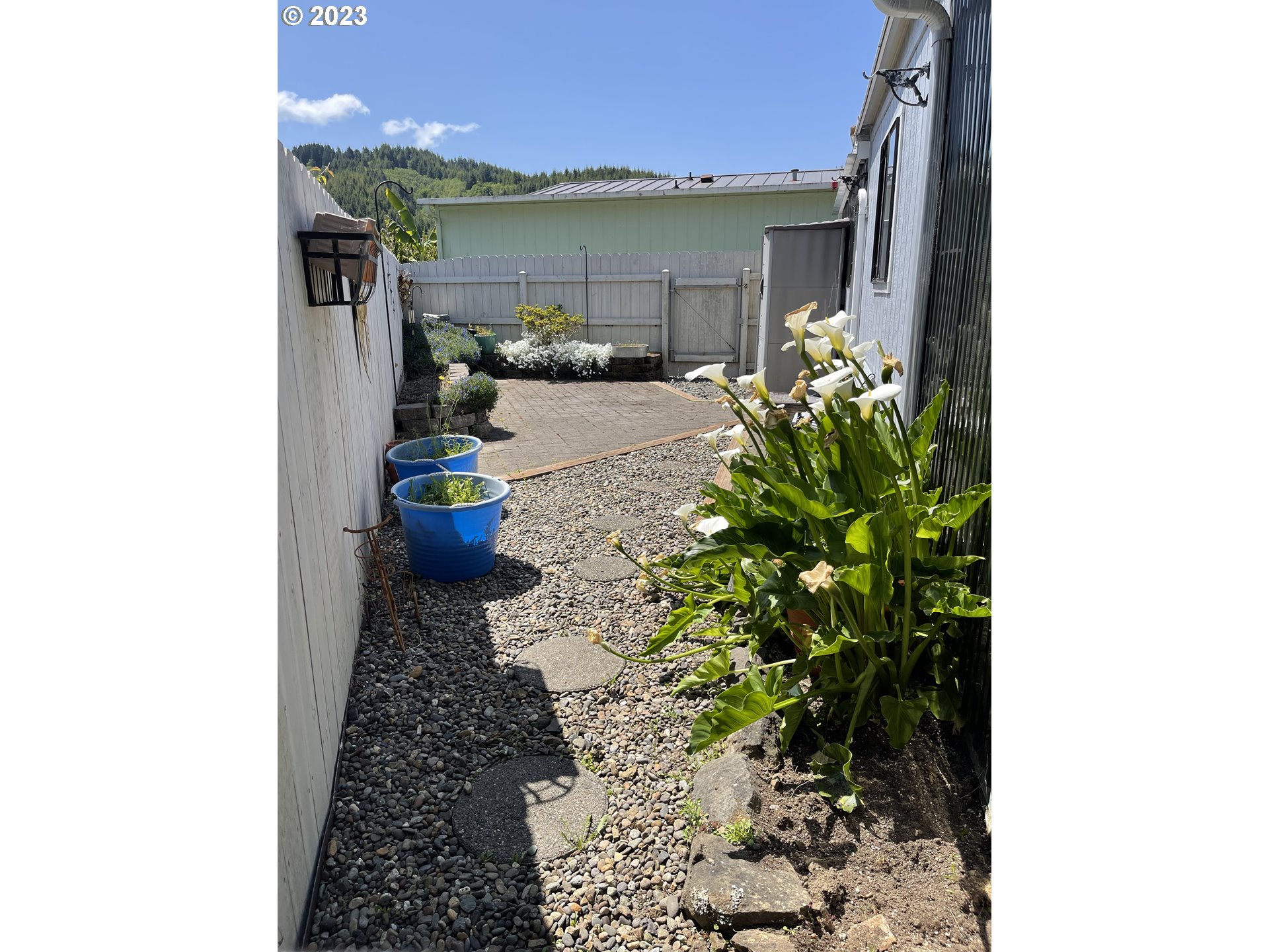 100 River Bend Road, Unit 121 Reedsport, OR 97467 - Photo 22 of 22 a view of a porch with potted plants