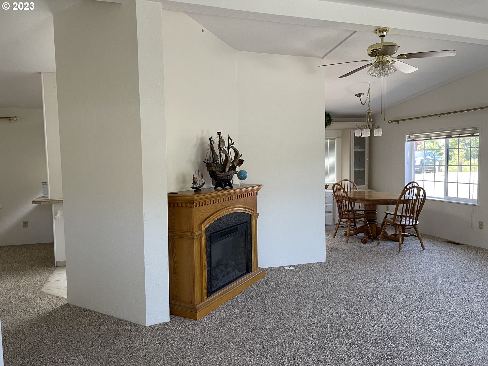 100 River Bend Road, Unit 121 Reedsport, OR 97467 - Photo 4 of 22 a view of a livingroom with furniture and a fireplace