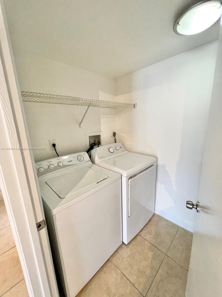 5612 Rock Island Road, Unit 141 Tamarac, FL 33319 - Photo 14 of 22 a utility room with dryer and washer