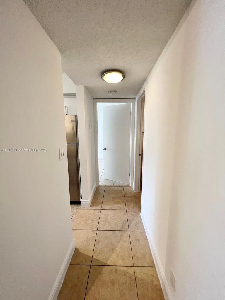 5612 Rock Island Road, Unit 141 Tamarac, FL 33319 - Photo 16 of 22 a view of a hallway