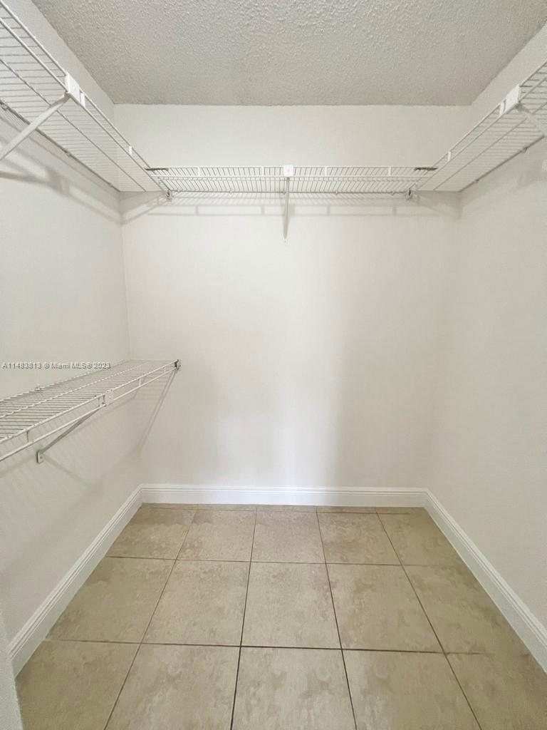 5612 Rock Island Road, Unit 141 Tamarac, FL 33319 - Photo 20 of 22 a view of a room with racks on the wall