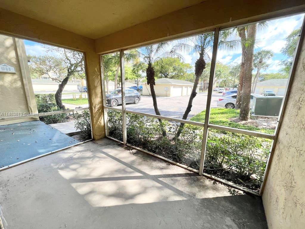 5612 Rock Island Road, Unit 141 Tamarac, FL 33319 - Photo 9 of 22 a view of a garden with an outdoor space