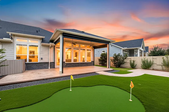 a front view of house and yard with green space
