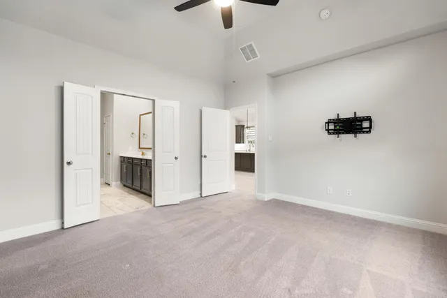 a spacious bathroom with a sink and a mirror