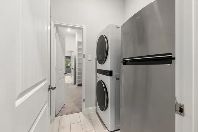 a bedroom with bed and painting on the wall