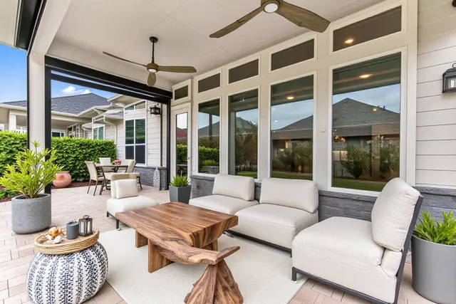 a view of a building with a large window and a rug