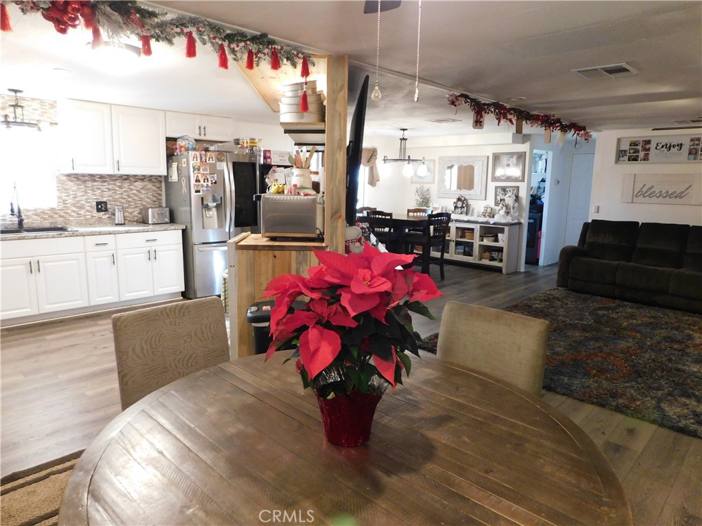 10350 Baseline, Unit 55 Alta Loma, CA 91701 - Photo 11 of 53 a living room with furniture and a chandelier