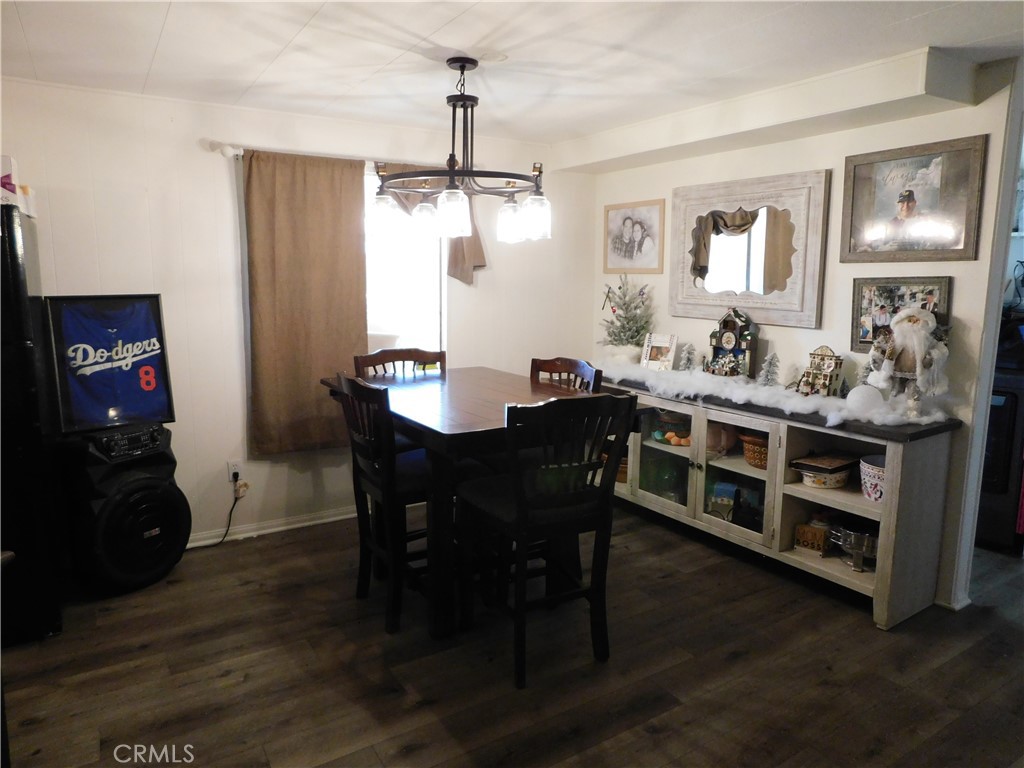 10350 Baseline, Unit 55 Alta Loma, CA 91701 - Photo 12 of 53 a view of a dining room with furniture wooden floor and chandelier