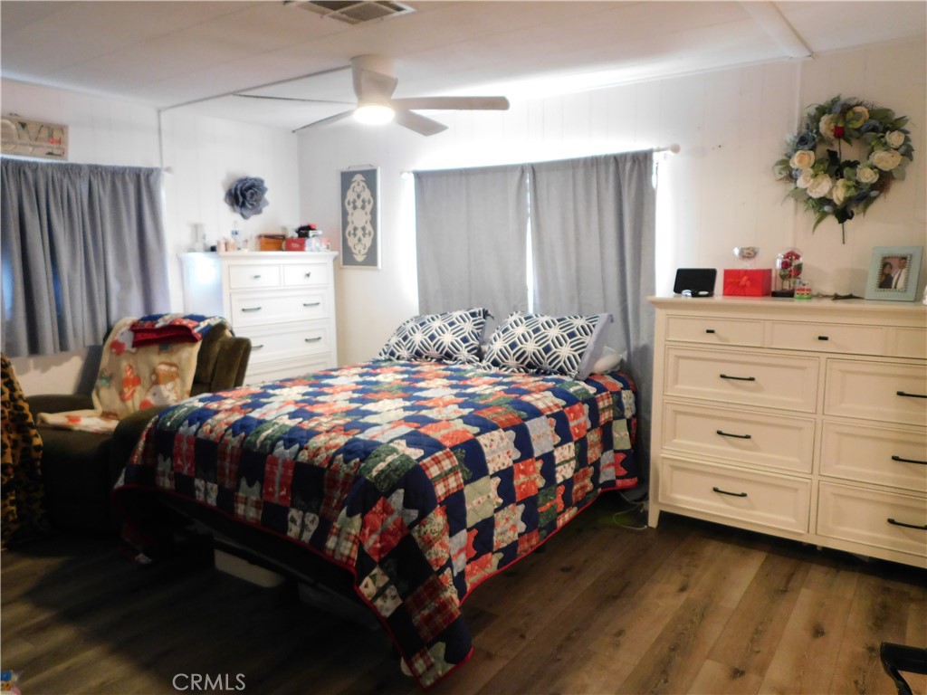 10350 Baseline, Unit 55 Alta Loma, CA 91701 - Photo 26 of 53 a bedroom with a bed and a dresser