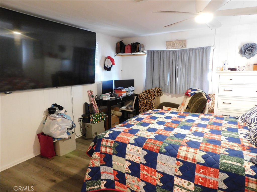 10350 Baseline, Unit 55 Alta Loma, CA 91701 - Photo 28 of 53 a bedroom with a bed and a flat screen tv