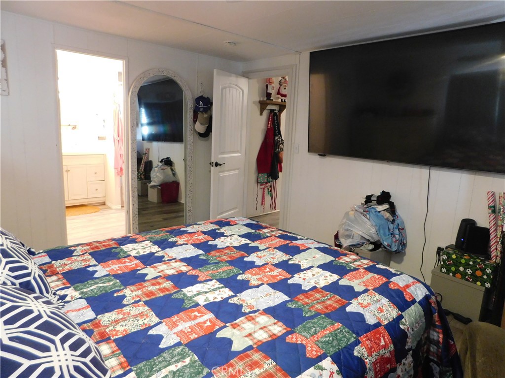 10350 Baseline, Unit 55 Alta Loma, CA 91701 - Photo 29 of 53 a bedroom with a bed and a television