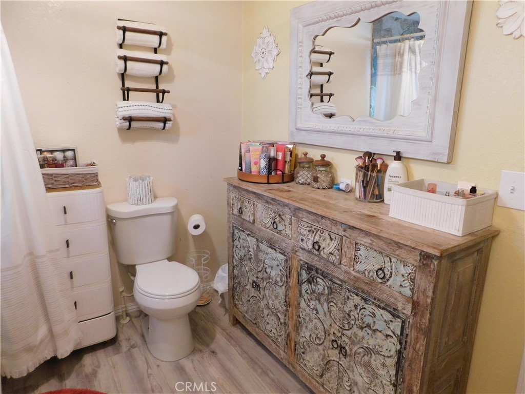 10350 Baseline, Unit 55 Alta Loma, CA 91701 - Photo 34 of 53 a bathroom with a toilet a sink and a mirror