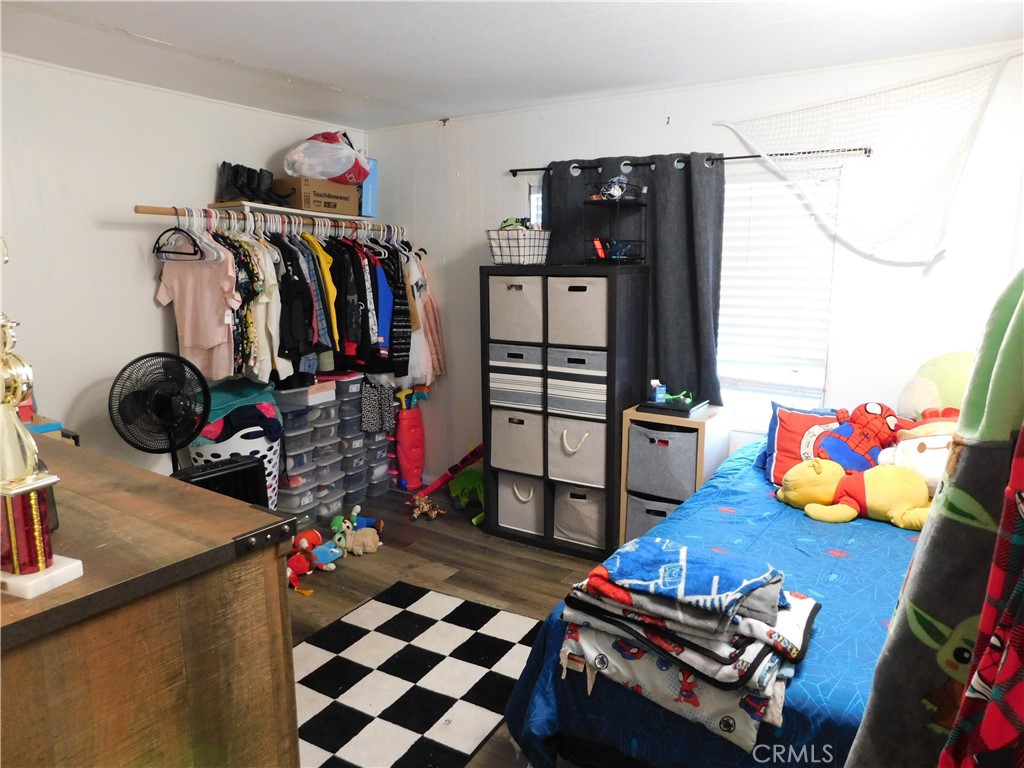 10350 Baseline, Unit 55 Alta Loma, CA 91701 - Photo 35 of 53 a room with gym equipment and wooden floor