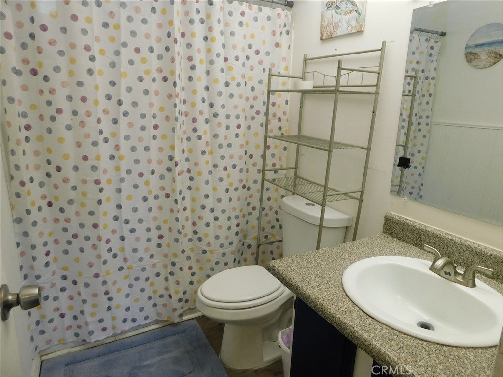 10350 Baseline, Unit 55 Alta Loma, CA 91701 - Photo 38 of 53 a bathroom with a toilet and a sink