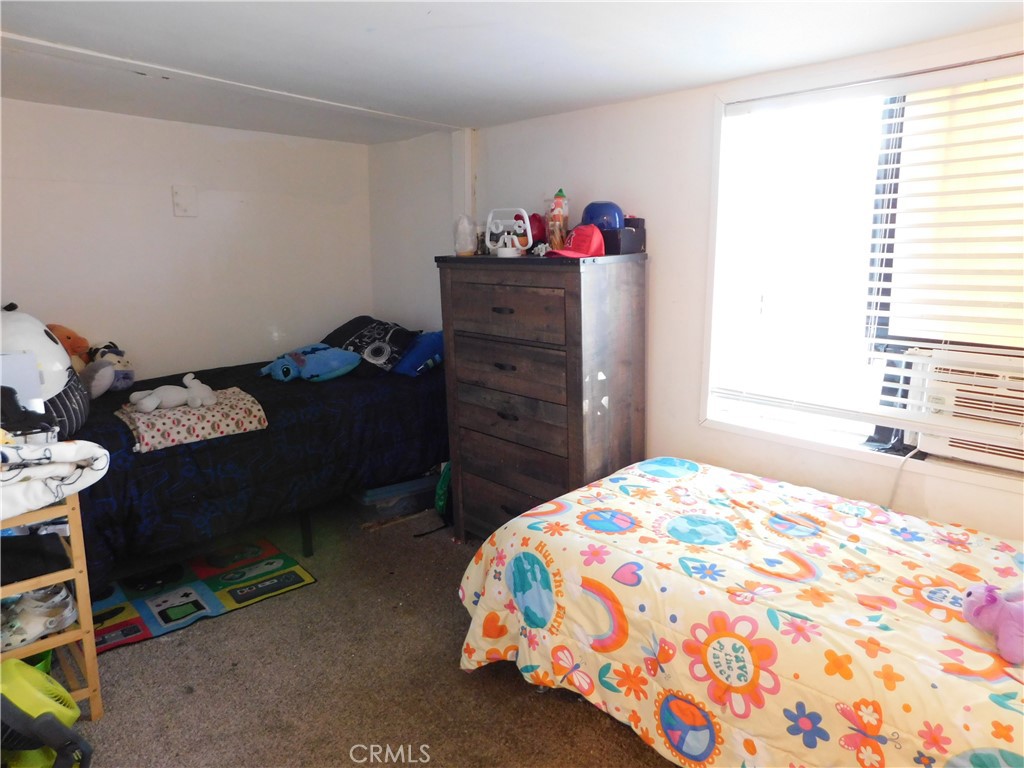 10350 Baseline, Unit 55 Alta Loma, CA 91701 - Photo 40 of 53 a bedroom with a bed and a window