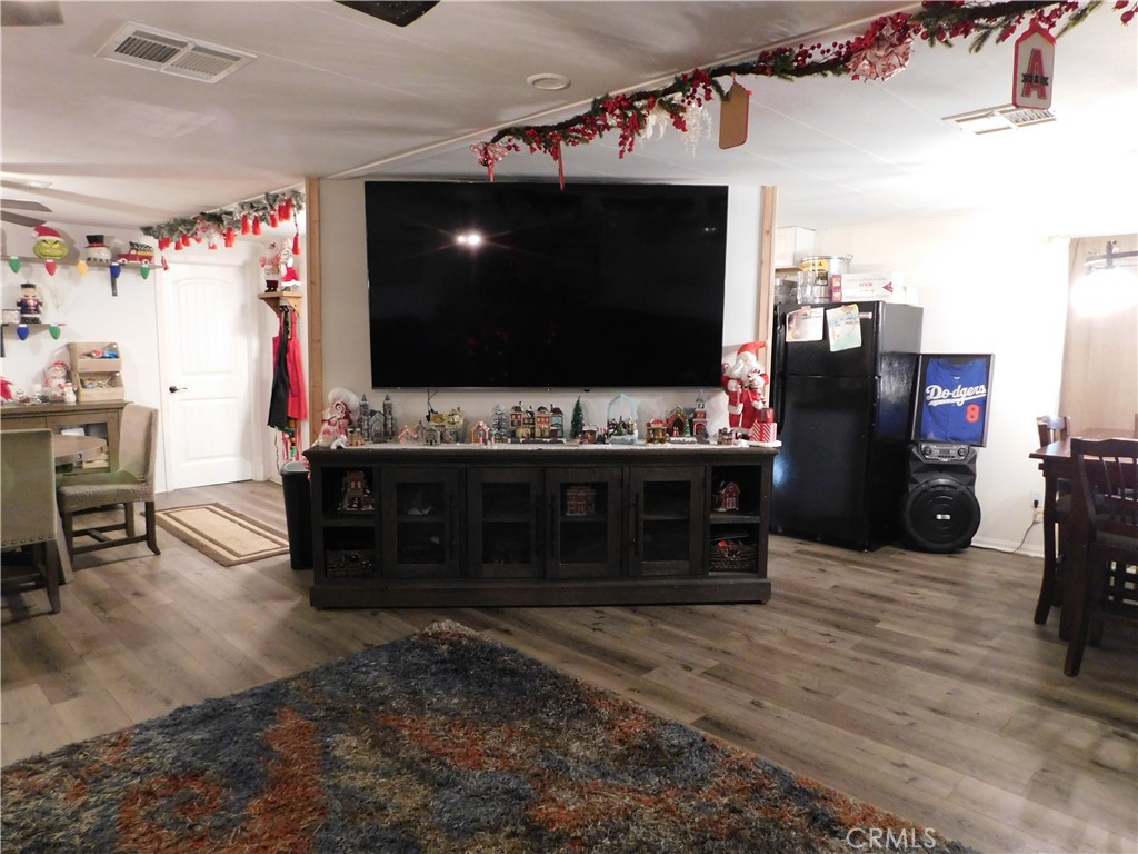 10350 Baseline, Unit 55 Alta Loma, CA 91701 - Photo 4 of 53 a living room with furniture and a flat screen tv