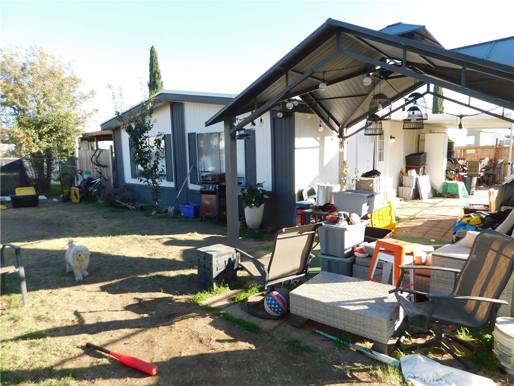 10350 Baseline, Unit 55 Alta Loma, CA 91701 - Photo 45 of 53 a view of a patio with table and chairs under an umbrella