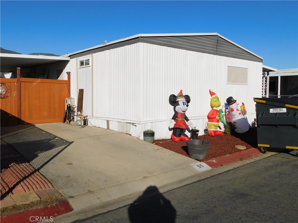 10350 Baseline, Unit 55 Alta Loma, CA 91701 - Photo 52 of 53 a group of people sitting in front of a house