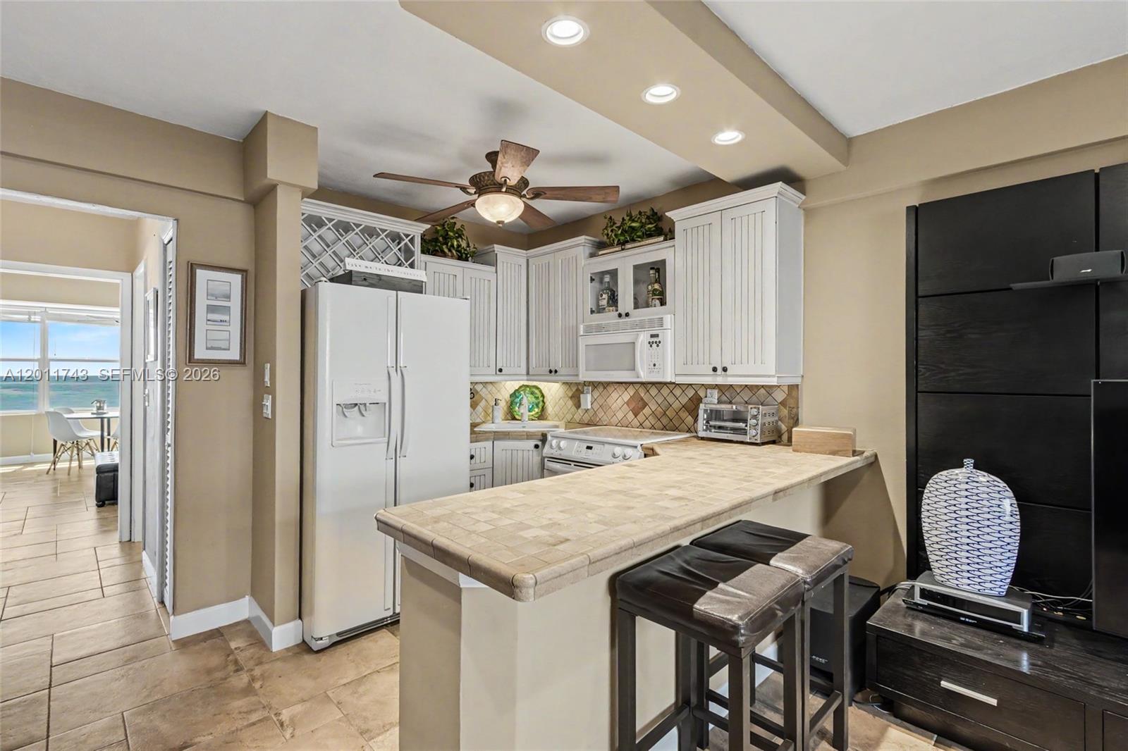 1801 South Surf Road, Unit 2G Hollywood, FL 33019 - Photo 15 of 32 a view of a dining room with furniture