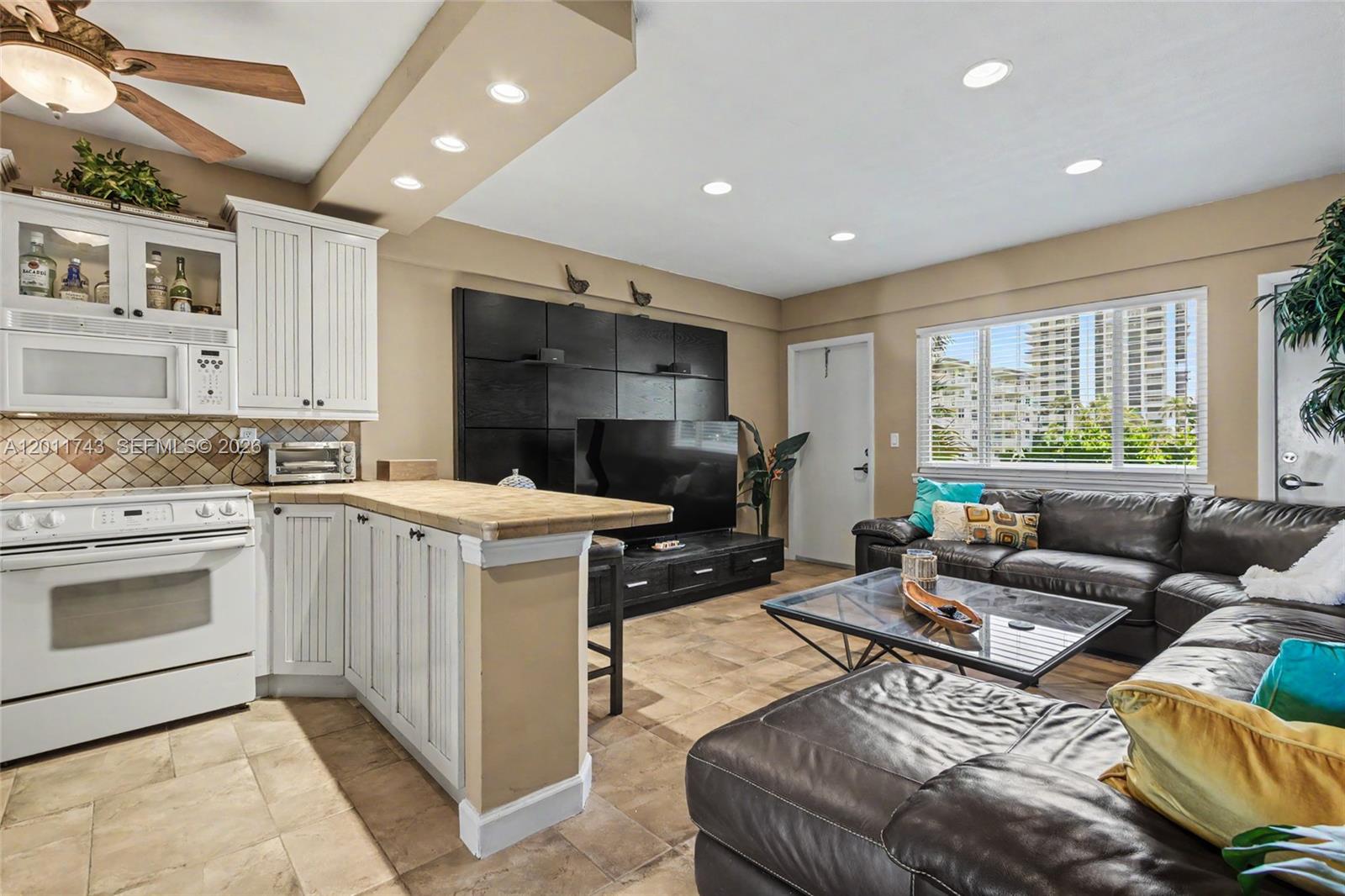 1801 South Surf Road, Unit 2G Hollywood, FL 33019 - Photo 17 of 32 a kitchen that has a sink and a stove in it