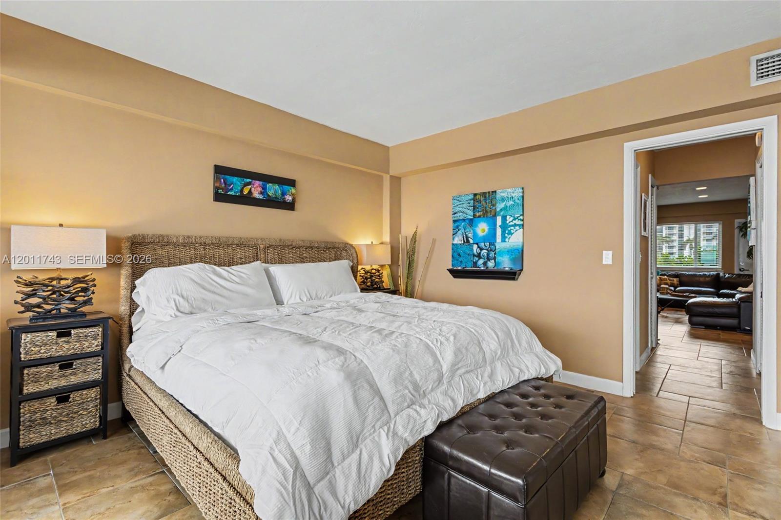 1801 South Surf Road, Unit 2G Hollywood, FL 33019 - Photo 23 of 32 a bedroom with a bed and a view of bathroom