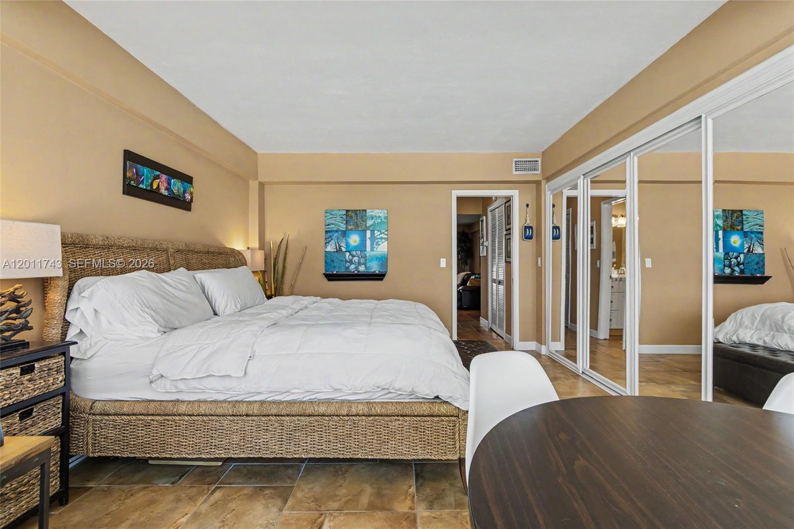 1801 South Surf Road, Unit 2G Hollywood, FL 33019 - Photo 26 of 32 a bedroom with a bed and a couch