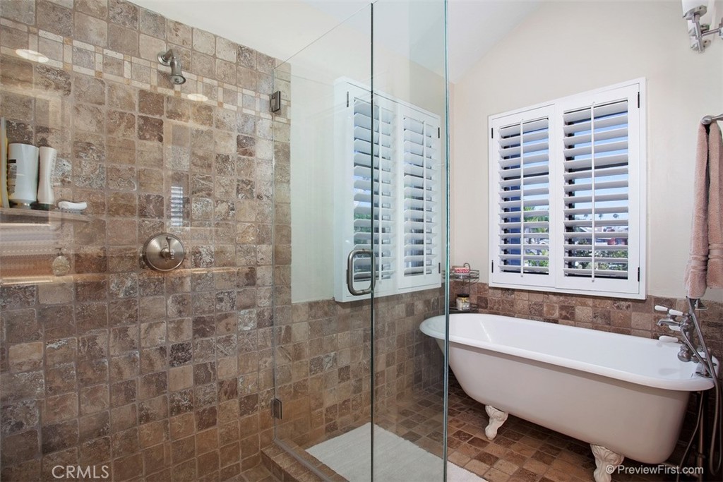 441 Carnation Avenue Corona del Mar, CA 92625 - Photo 12 of 25 a bathroom with a bathtub and next to a window