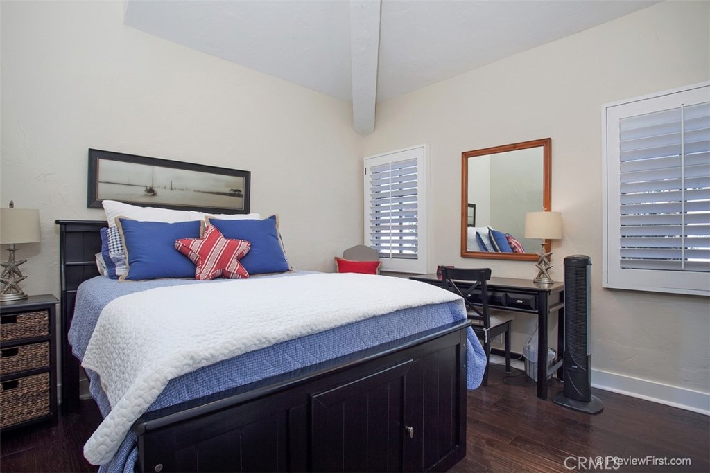 441 Carnation Avenue Corona del Mar, CA 92625 - Photo 13 of 25 a bedroom with a bed and a desk