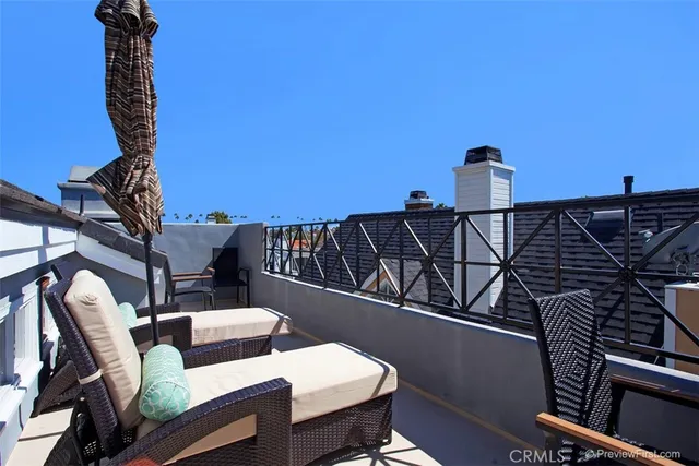 a view of a balcony with chairs
