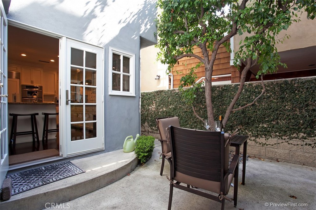 441 Carnation Avenue Corona del Mar, CA 92625 - Photo 21 of 25 a wooden bench sitting in front of a building