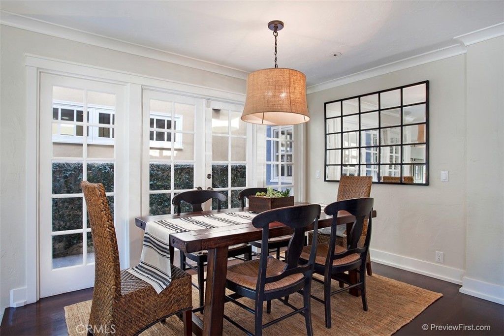 441 Carnation Avenue Corona del Mar, CA 92625 - Photo 4 of 25 a view of a dining room with furniture window and wooden floor