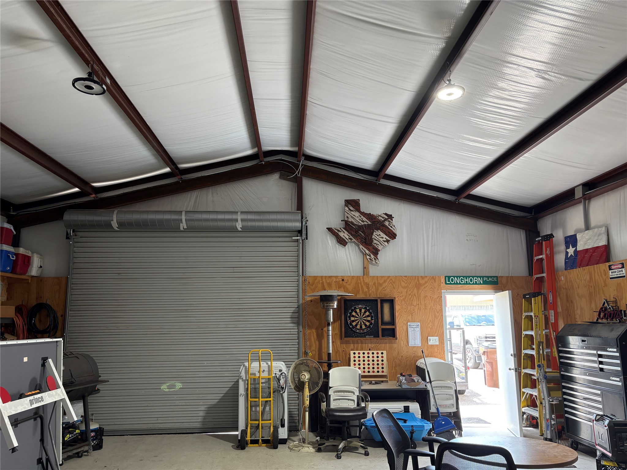 1512 Panther Loop Pflugerville, TX 78660 - Photo 36 of 40 Secure, oversized rollup door offers ample access for large vehicles and equipment into this functional space.