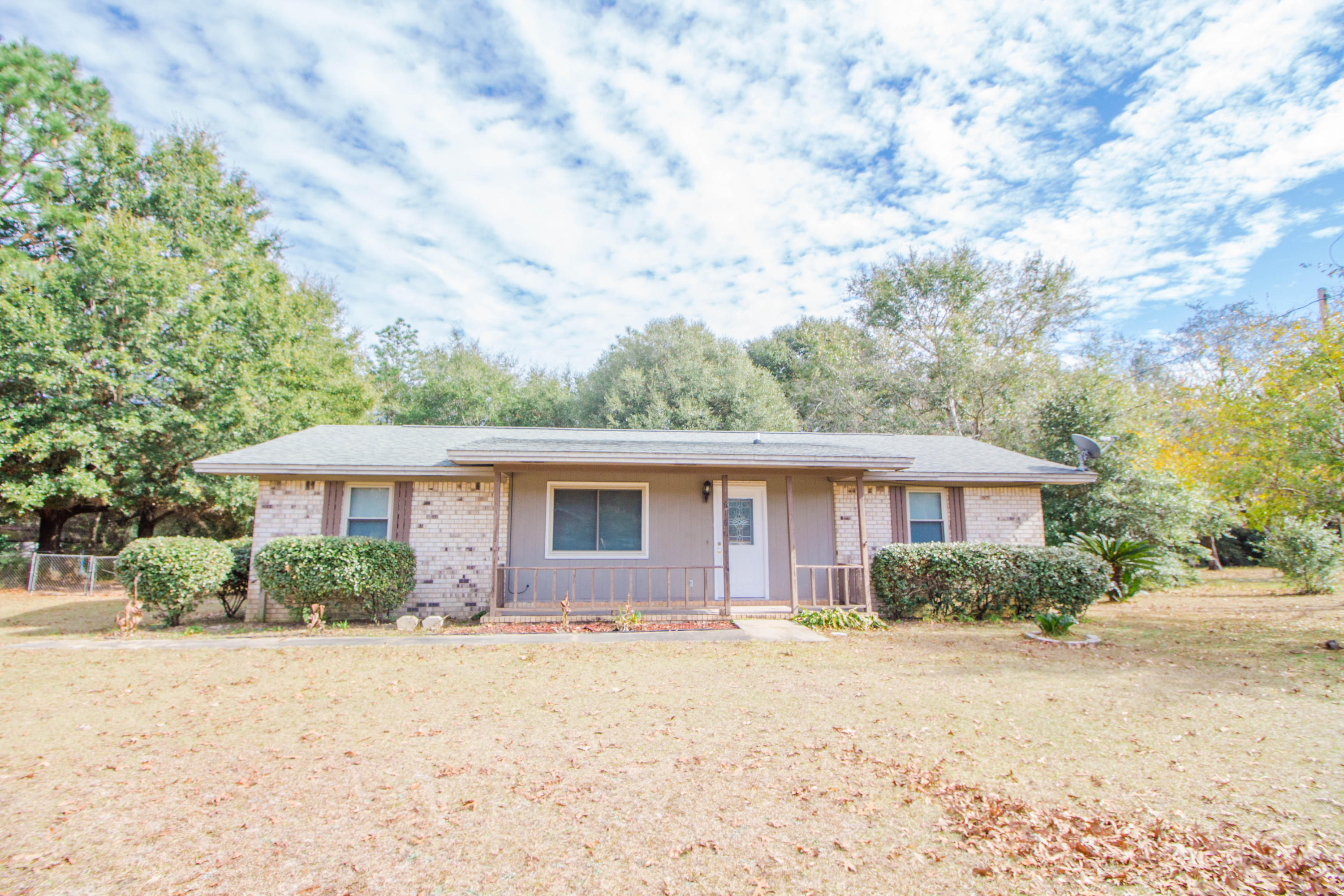 6163 Old Hickory Road Crestview, FL 32539 - Photo 2 of 21 a front view of house with yard and trees around