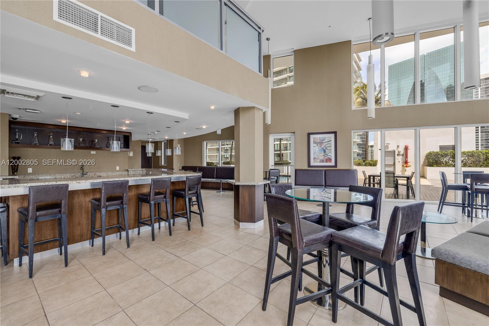 60 Southwest 13th Street, Unit 1124 Miami, FL 33130 - Photo 30 of 30 a dining room with lots of tables and chairs