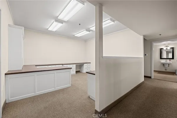 a view of walk in closet with white walls