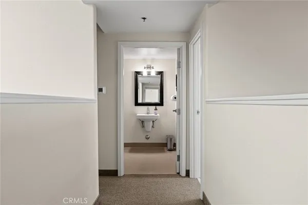 a en suite bathroom with a toilet sink and mirror