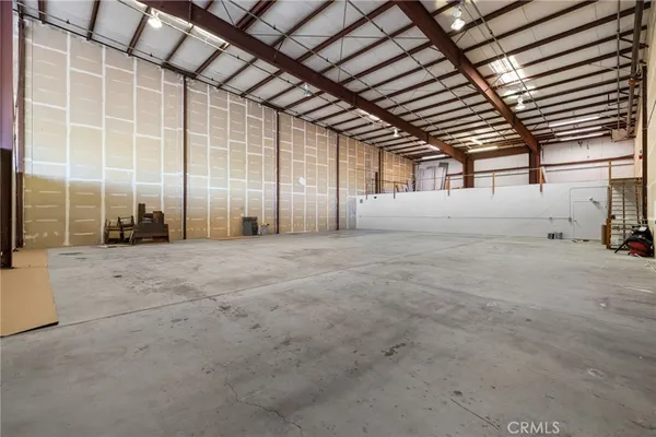 a view of a empty room with a garage