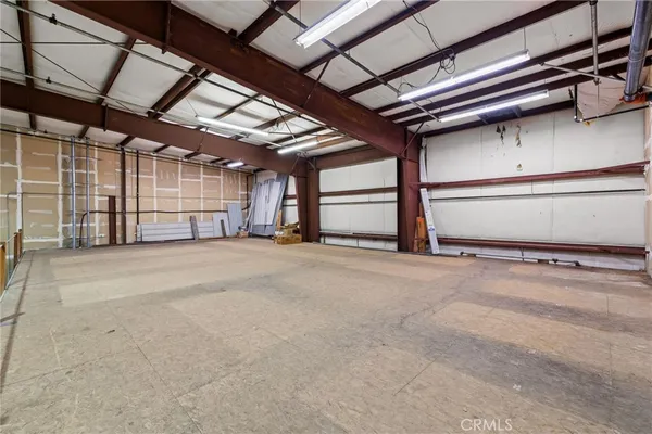 a view of a building with car parked