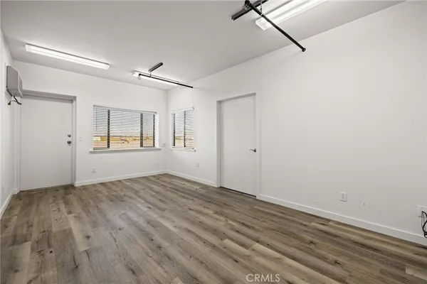 a bathroom with a sink mirror and toilet